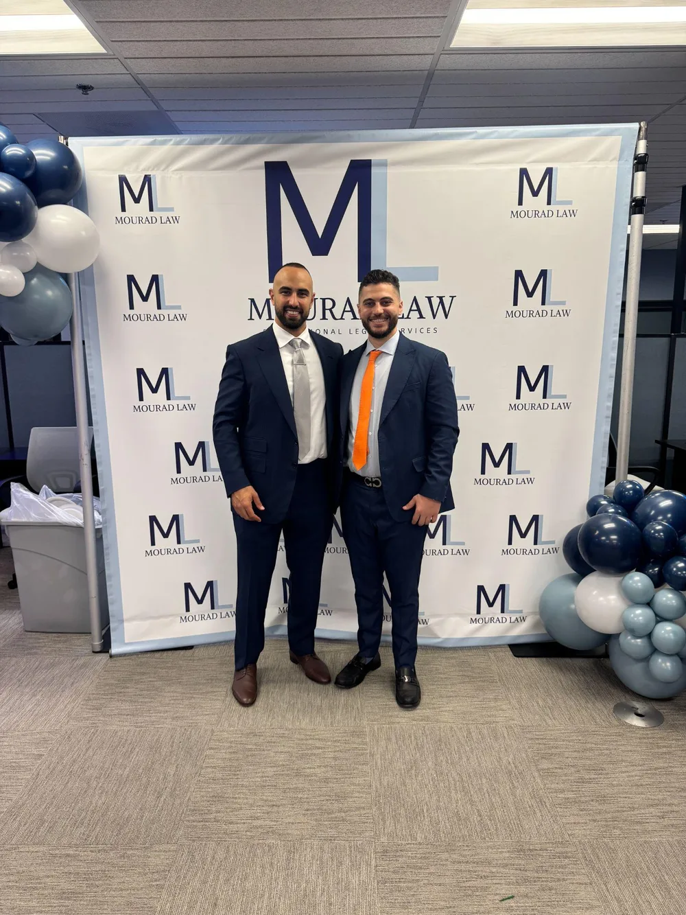 Miguel Brikho, Esq. with a colleague